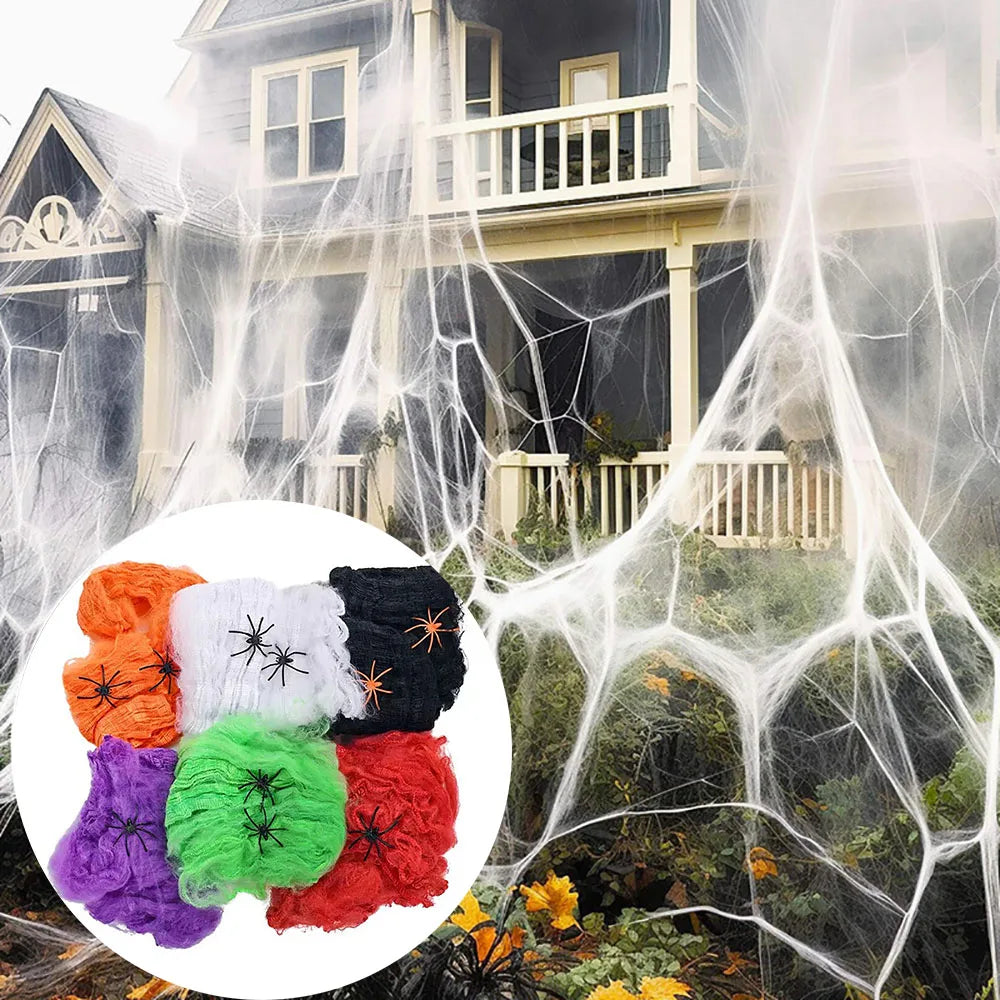 White stretch spider web with black plastic spiders on a porch
