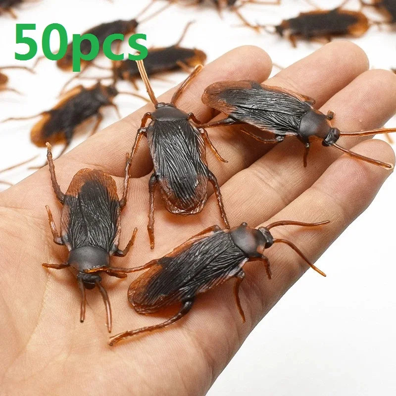 Realistic fake cockroaches in a hand