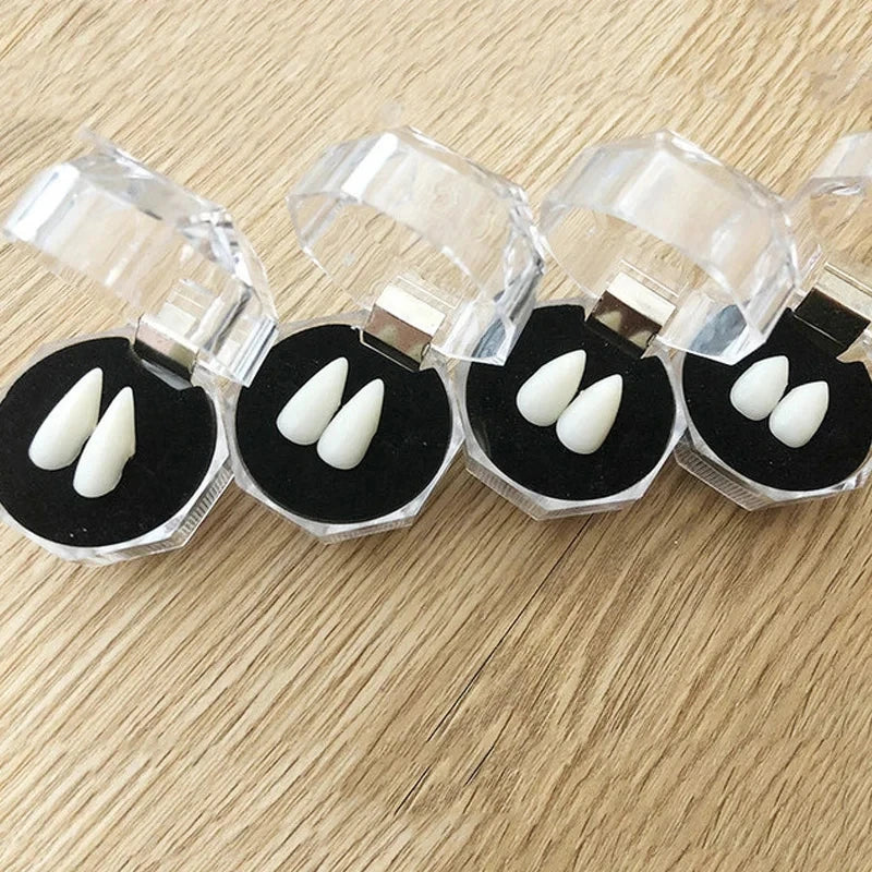 Vampire fang set in clear cases with adhesive beads