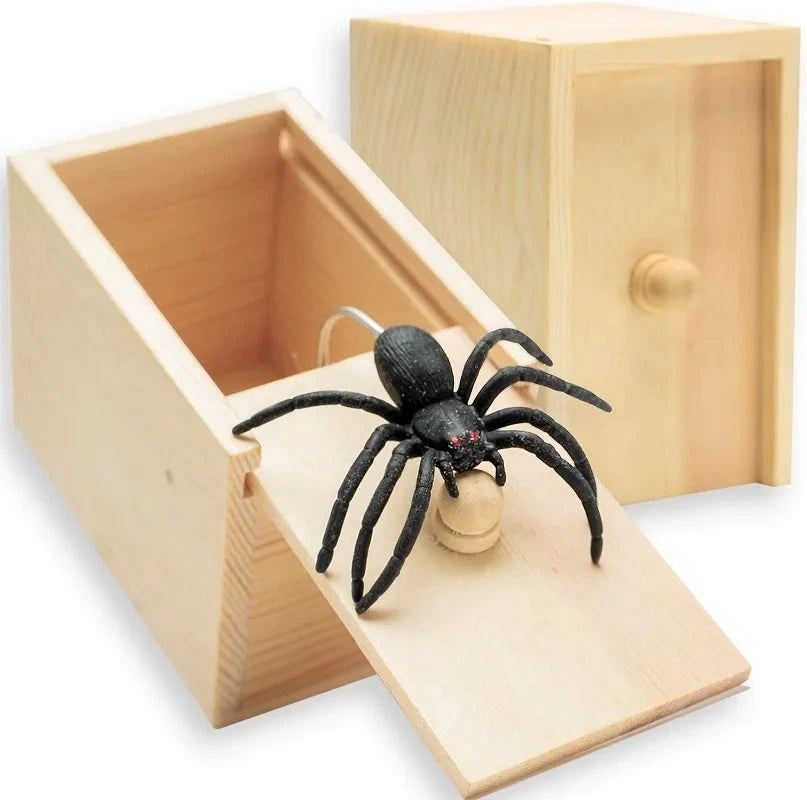 Wooden prank box with a rubber spider popping out