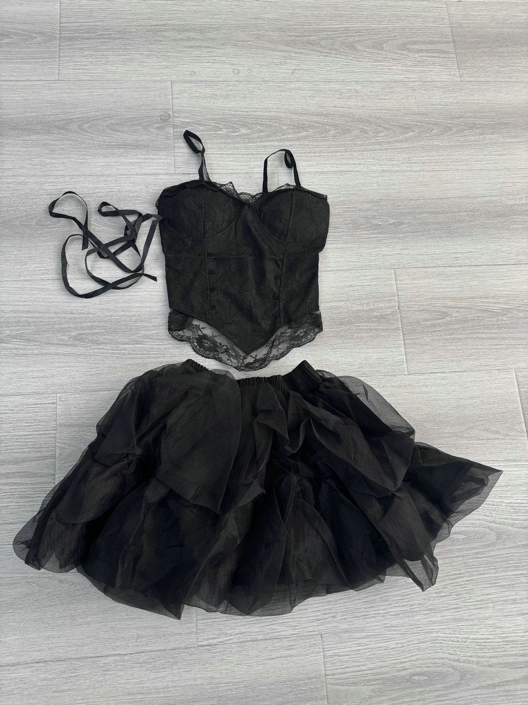 Black gothic corset top with lace trim and layered black tulle tutu skirt