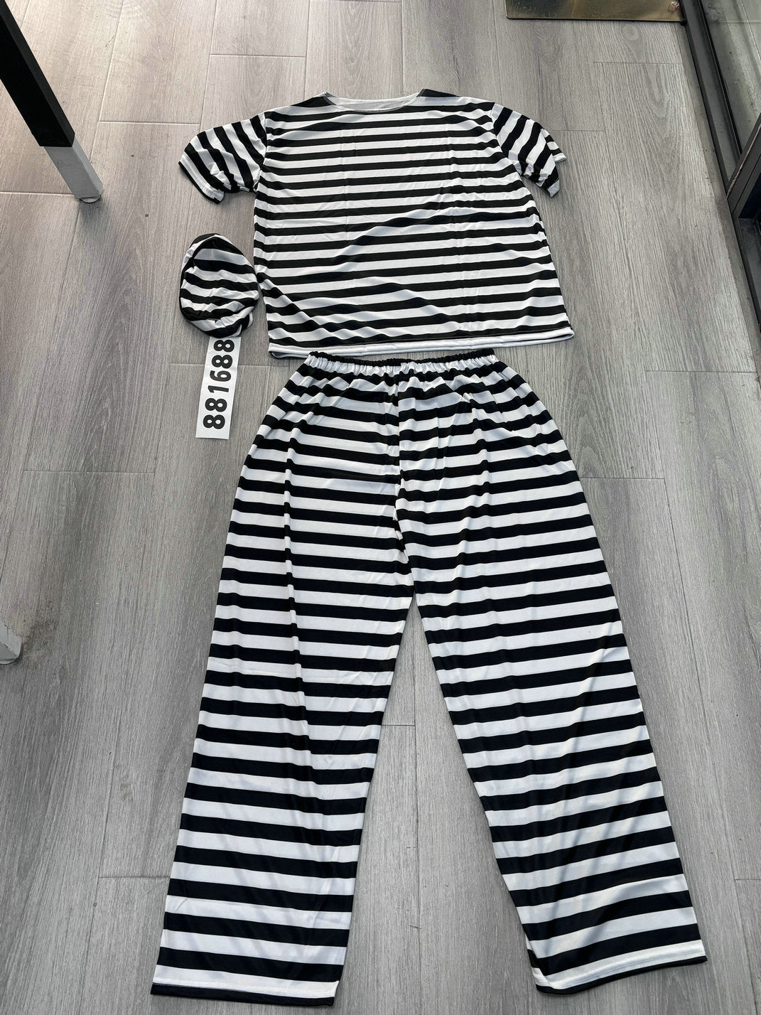 Men's black and white striped prisoner costume with cap and number tag